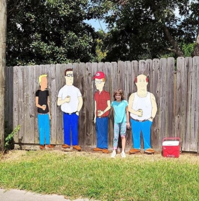 Why are there 'King of the Hill' figures in the front yard?