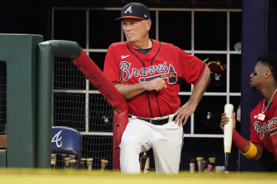 Atlanta Braves manager Brian Snitker watches from the dugout