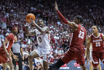 Arkansas rallies, then holds on to beat Auburn 75-73