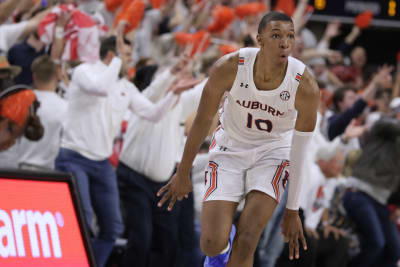 FILE - Oklahoma State guard Cade Cunningham (2) celebrates with