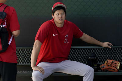 Los Angeles Angels' Shohei Ohtani flexes his muscles before a