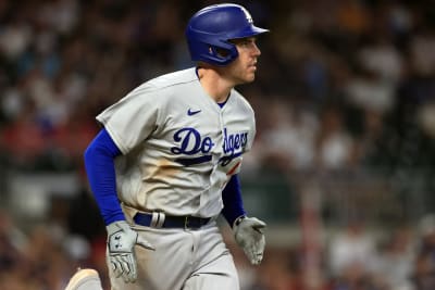 FILE - Atlanta Braves' Freddie Freeman smiles after scoring on a hit by  Marcell Ozuna against the Los Angeles Dodgers during the sixth inning in  Game 4 of a baseball National League