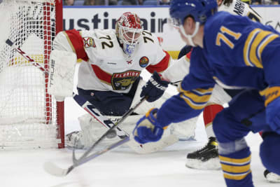 Montreal Canadiens' Sam Montembeault wears a pride-themed warmup