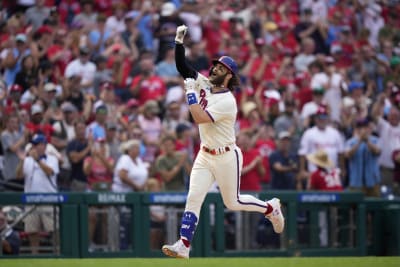 Phillies star Bryce Harper makes catch tumbling into photo pit in first  career start at first base