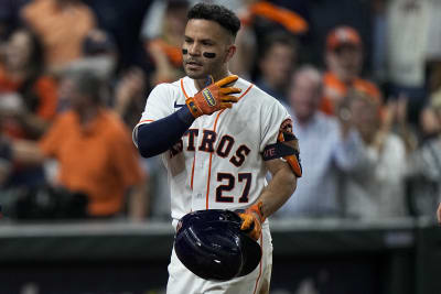 Houston Astros' Jose Altuve and Carlos Correa celebrate after Game