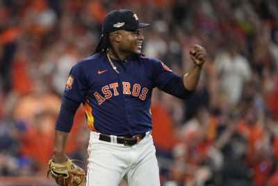 Houston Astros fans hold signs supporting second baseman Jose Altuve (27)  and designated hitter Yordan Alvarez before a baseball game between the  Seattle Mariners and the Astros, Friday, July 22, 2022, in