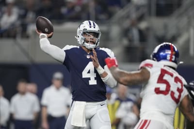 Dallas Cowboys quarterback Dak Prescott (4) celebrates with wide receiver  CeeDee Lamb (88) afte …