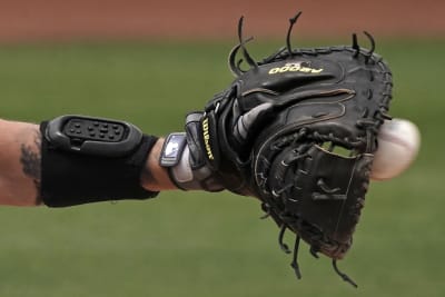 San Diego Padres' Alfonso Rivas advances from second base before being  tagged out at third off a fielder's choice by Fernando Tatis Jr. during the  fourth inning of a baseball game against