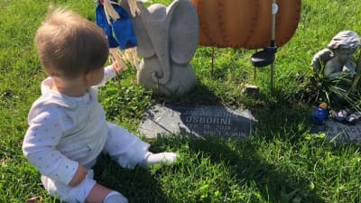 Little boy visits grave to honor identical twin who died in the womb