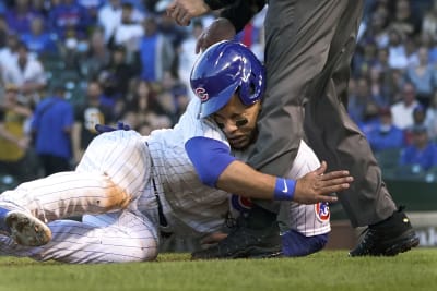 Willson Contreras of the Chicago Cubs beats the tag from Tony