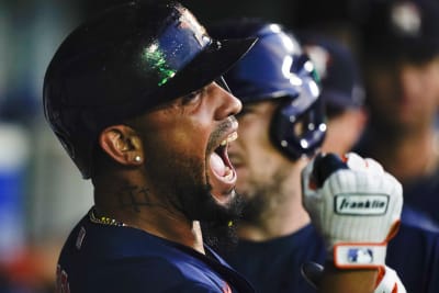 Los Angeles Angels' Mike Moustakas celebrates after hitting a