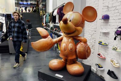 Minnie Mouse trades iconic dress for a pantsuit. Not everyone's a fan.