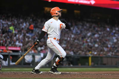 San Francisco Giants' Barry Bonds watches his three-run homer off