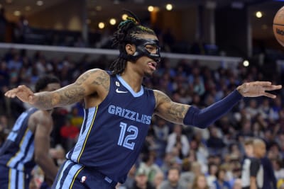 Memphis Grizzlies guard Ja Morant, right, and forward Jaren Jackson Jr.  warm up before an NBA basketball game against the Oklahoma City Thunder  Wednesday, Dec. 7, 2022, in Memphis, Tenn. (AP Photo/Brandon