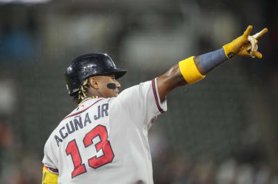 Braves' Ronald Acuna Jr. falls after fans run on field