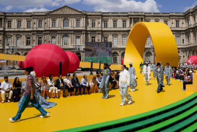 Louis Vuitton inserts a yellow racetrack at the Louvre for Spring Summer 2023  show