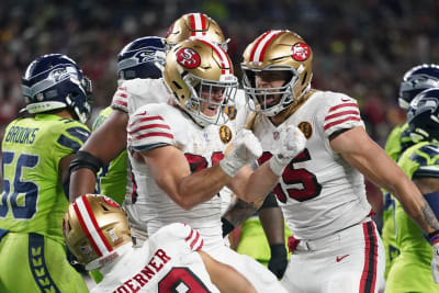 Christian McCaffrey's 2nd TD rallies the 49ers to 24-21 playoff