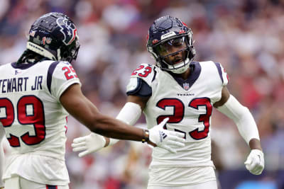 Houston Texans draft pick John Metchie III stretches during an NFL