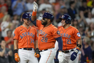 Houston Astros' Christian Vazquez (9) is hugged by former teammate