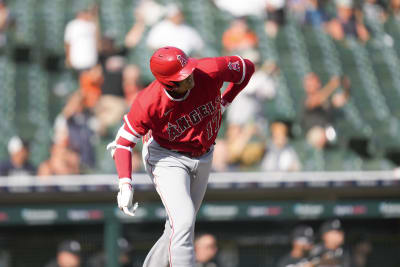 Shohei Ohtani of the Los Angeles Angels celebrates wearing a samurai  warrior helmet in the dugout after hitting a two-run home run in the third  inning of a baseball game against the