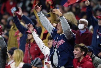 Cleveland Guardians fans cheer before a wild card baseball playoff