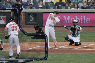 Arizona Diamondbacks batter Luis Gonzalez watches his solo homerun