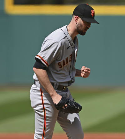 The San Francisco Giants' Brandon Belt reacts after striking out