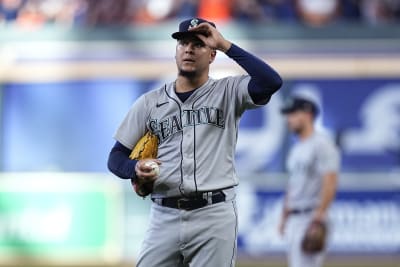 Houston Astros fans hold signs supporting second baseman Jose Altuve (27)  and designated hitter Yordan Alvarez before a baseball game between the  Seattle Mariners and the Astros, Friday, July 22, 2022, in