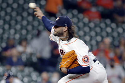 Houston Astros starting pitcher Lance McCullers Jr., right, leaps