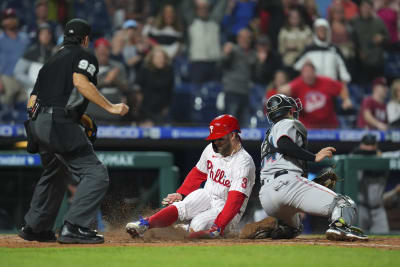 Miami Marlins left fielder Adam Duvall (14) and shortstop Miguel