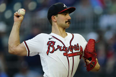 Spencer Strider of the Atlanta Braves talks with Mike Soroka of