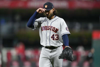 Houston Astros starting pitcher Lance McCullers Jr., right, leaps