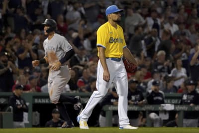 Yankees' Kyle Higashioka reacts to injuring Red Sox pitcher with