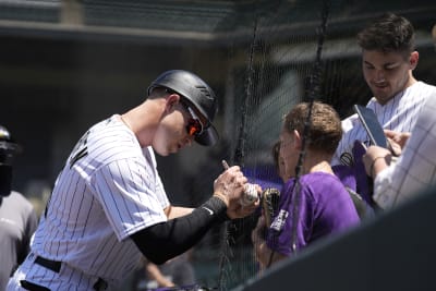 Rockies rook fouls 1st MLB pitch near family, mom gets ball