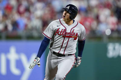 Atlanta Braves Orlando Arcia (11) reacts after a swinging strike