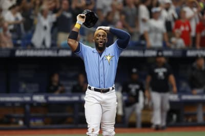 Tampa Bay Rays' Brandon Lowe throws his helmet after striking out