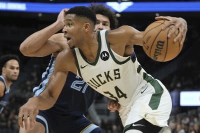 FILE - In this July 20, 2021, file photo, Milwaukee Bucks forward Giannis  Antetokounmpo holds the NBA Championship trophy, left, and Most Valuable  Player trophy after defeating the Phoenix Suns in Game