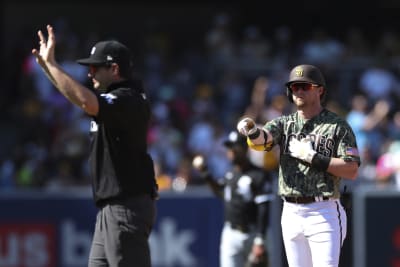 Cardinals reliever Gallegos gets wiped down by umpire after using rosin bag  on his left arm