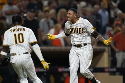 Manny Machado of the San Diego Padres celebrates after hitting an