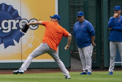 New York Mets starting pitcher Max Scherzer tosses the ball up