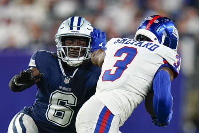 NFC wide receiver CeeDee Lamb, right, of the Dallas Cowboys, and AFC  cornerback J.C. Jackson, left, of the New England Patriots, reach for an  incomplete pass during the second half of the