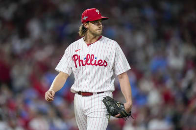 Harper hits grand slam in 9th, Phillies rally past Cubs 7-5