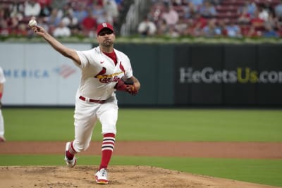 Cardinals reliever Gallegos gets wiped down by umpire after using rosin bag  on his left arm