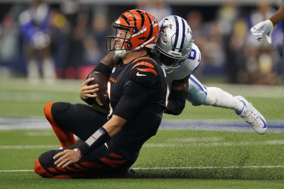 Cincinnati Bengals defensive end Trey Hendrickson (91) is led off the field  after being injured against the Pittsburgh Steelers during the first half  of an NFL football game, Sunday, Nov. 20, 2022