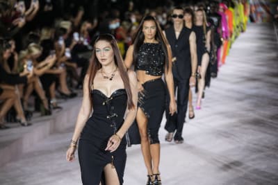 Dua Lipa walks the Versace runway, Prada resists normality