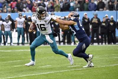 Jacksonville Jaguars quarterback Trevor Lawrence (16) looks for a