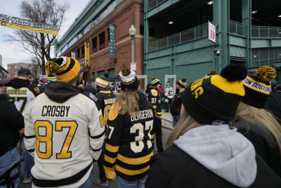 Bruins players wear vintage Red Sox uniforms before Winter Classic