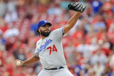 Los Angeles Dodgers reliever Kenley Jansen carries his daughter