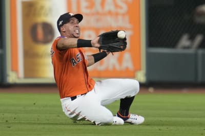 Close-up of young baseball player with dirty jersey jogging off the field  stock photo