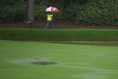 The Masters: Third round suspended as rain drenches field at